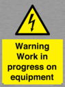 warning-work-in-progress-on-equipmentwith-electrical-hazard-symbol~